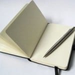 black_notebook_with_pencil